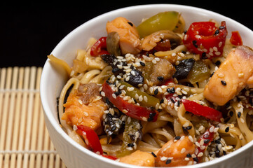 Chinese noodles with vegetables and salmon