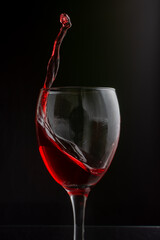 A beautiful splash of red wine in a glass