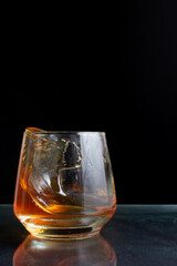 Pour whiskey in a glass on the table