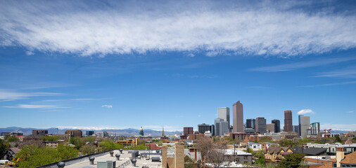Obraz premium Denver, Colorado skyline with blue sky and clouds