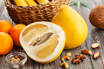 sliced pomelo on wood background