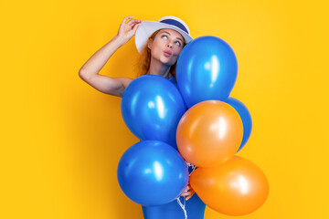 Fototapeta na wymiar positive woman with balloons at summer birthday isolated on yellow. woman