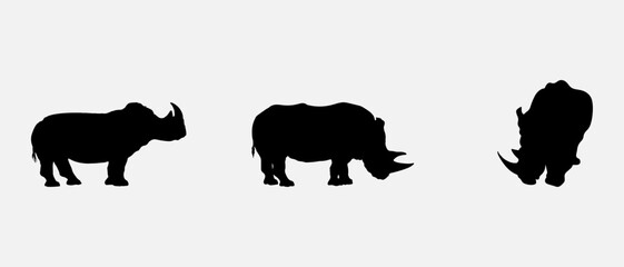 isolated black silhouette of a rhinoceros , vector collection