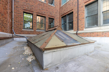 Barrel vault skylight screen fall protection guard installed on a commercial, industrial, or school...