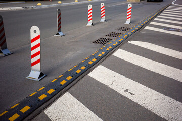 automobile marking for cars, rubber barriers for pedestrians