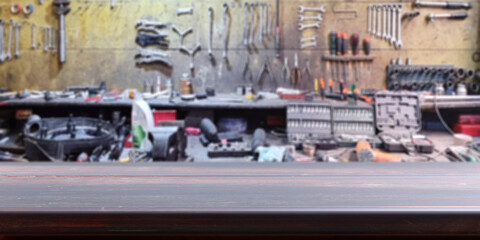 Empty wooden table, blur workshop and garage tools background