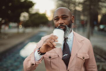 Close-Up Portrait of Bald MLisbon; A bald man with a stylish beard poses for a close-up portrait;...