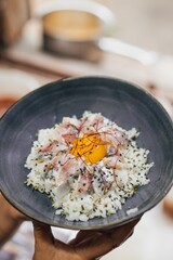 Gohan rice and smoked mackerel to be served in a restaurant 