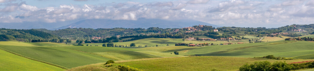 Panoramic view of the Tuscan countryside in spring in the province of Pisa, between Orciano Pisano and Lorenzana, Italy