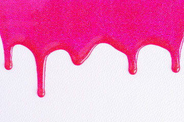 Pink glitter sparkle confetti background liquid drops of paint color flow down on white canvas....