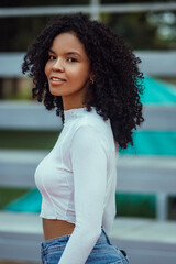 beautiful woman with dark and curly skin