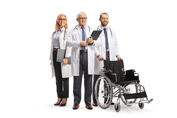 Team of doctors specialists standing with a wheelchair
