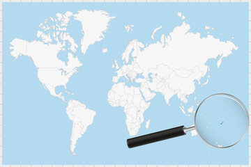 Magnifying glass showing a map of Fiji on a world map.