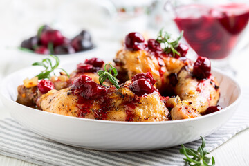 Chicken legs with cherry sauce and rosemary.