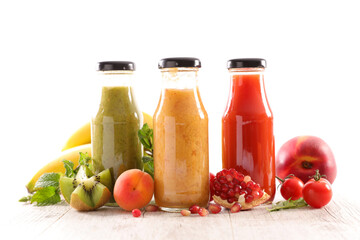 fruit juice in bottle with fresh fruits ingredients