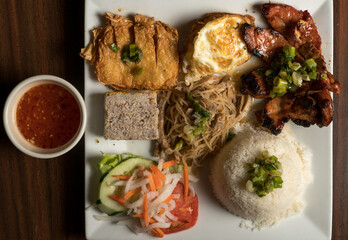 Pork chop, pork skin, steamed pork cakes, fried egg and rice