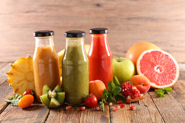 fruit juice in bottle with fresh fruits ingredients
