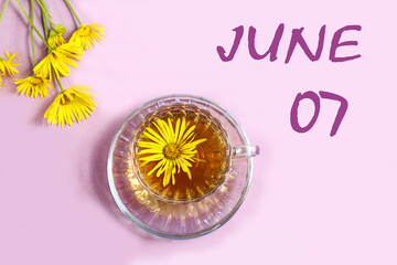 Calendar for June 7: a cup of tea with yellow daisies, a bouquet of daisies on a pastel background, the numbers 07, the name of the month of June in English