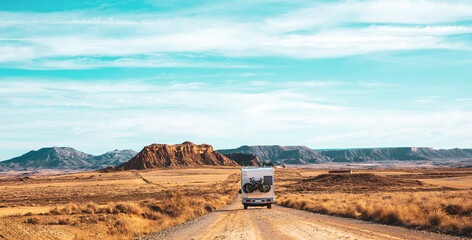 motorhome in desert landscape- vacation, adventure, road trip concept- Bardenas reales in Spain