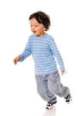 Little boy running on white.