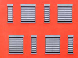 pattern of windows with red wall