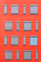pattern of windows with red wall