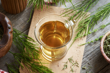 Horsetail tea in a glass cup