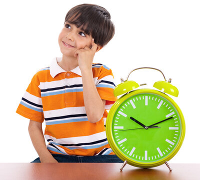 Boy thinking deeply near the clock