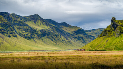 Volcanic shaped landscape, moss covered mountains in summer, Iceland