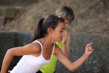 Mother coaching her teenage daughter