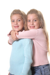 happy sisters hug vertical on white