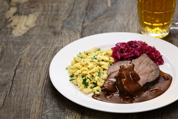 Sauerbraten (a German national dish, marinated braised beef) with Rotkohl (red cabbage), Spaetzle(small egg pasta)