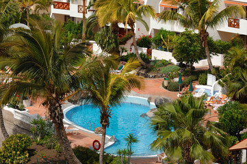 Fototapeta na wymiar Luxury resort with very nice pool and palms