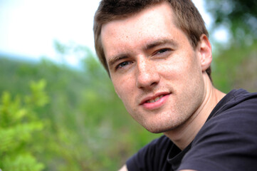 Fototapeta premium Close-up. Portrait of the beautiful young man of the outdoors
