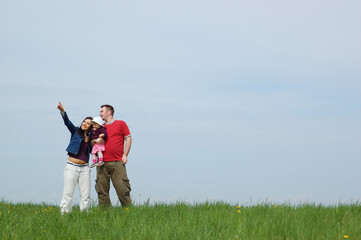 happy family together on green meadow