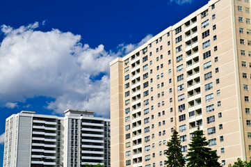 Tall residential apartment buildings with blue sky