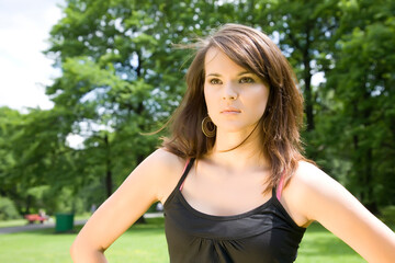 Brunette Woman In The Summer Park