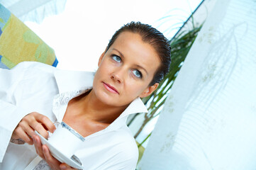 High key portrait of nice gorgeous woman drinking coffee