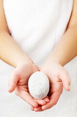 Closeup of womans hands holding spa treatment.