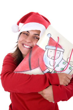 happy young santa woman in red clothing holding present bag in her hands. isolated on white background.
