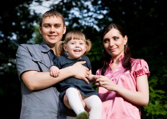 Happy Family Close-Up Portrait Outdoors
