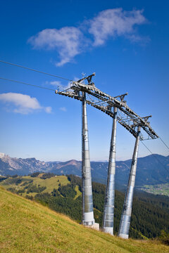Ski lift tower under high mountains, Gosau Austria