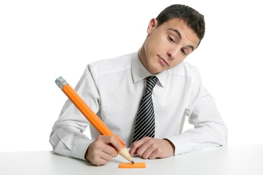 Young businessman student thinking gesture with huge giant pencil