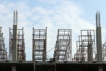 building structure under construction and steel scaffolding.