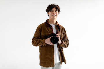 Professional creative photography career concept. Happy handsome photographer man posing holding photo camera - obrazy, fototapety, plakaty