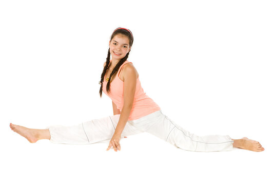 Young girl doing fitness exercises on white background