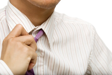 Businessman untie the tie for rest,closeup and focus on tie.