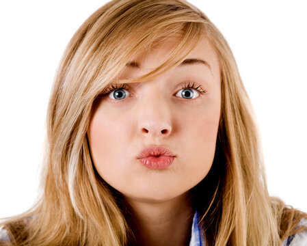 young girl give kiss to the camera on isolated background