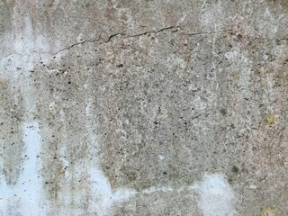 The grunge texture is an old gray concrete wall.
