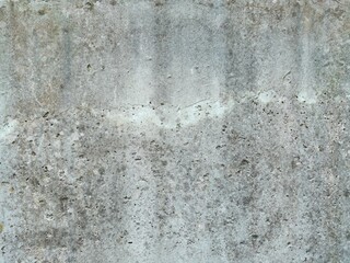 The grunge texture is an old gray concrete wall.